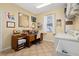 Bright office featuring a desk, workspace, natural light, and a laundry area at 26622 Bull Run, Leesburg, FL 34748