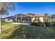 This home has a screened-in lanai and solar panels for energy efficiency at 26622 Bull Run, Leesburg, FL 34748