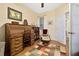 Well-lit study with wooden desk, bookcase, and comfortable chair at 26622 Bull Run, Leesburg, FL 34748