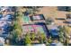 Overhead view of the community tennis and bocce ball courts, beautifully landscaped with mature trees at 26622 Bull Run, Leesburg, FL 34748