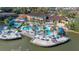 Expansive pool area with a waterslide and lakefront access at 2713 Roadster Ln, Kissimmee, FL 34746