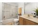 Bathroom with tub, shower, and updated vanity at 2713 Roadster Ln, Kissimmee, FL 34746