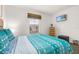 Bright bedroom with a queen bed and large window at 2713 Roadster Ln, Kissimmee, FL 34746