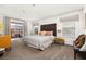 Spacious bedroom with a king-size bed and private balcony access at 2713 Roadster Ln, Kissimmee, FL 34746