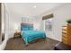 Charming bedroom with a full-size bed and plenty of natural light at 2713 Roadster Ln, Kissimmee, FL 34746