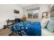 Spacious bedroom with a queen bed, workspace, and natural light at 2713 Roadster Ln, Kissimmee, FL 34746