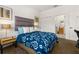 Bedroom with queen bed, en-suite bathroom access, and ample natural light at 2713 Roadster Ln, Kissimmee, FL 34746