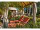 Private cabana with lounge chairs near the pool at 2713 Roadster Ln, Kissimmee, FL 34746