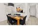 Open dining area with kitchen views and breakfast bar at 2713 Roadster Ln, Kissimmee, FL 34746