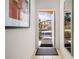 Bright and airy entryway with mirror and view of the exterior at 2713 Roadster Ln, Kissimmee, FL 34746