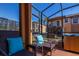 Relax in this screened-in patio with hot tub and seating at 2713 Roadster Ln, Kissimmee, FL 34746
