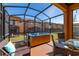 Relaxing hot tub on patio with screened enclosure at 2713 Roadster Ln, Kissimmee, FL 34746