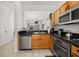 Modern kitchen with stainless steel appliances and granite countertops at 2713 Roadster Ln, Kissimmee, FL 34746