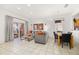 Open living area with dining space and patio access at 2713 Roadster Ln, Kissimmee, FL 34746
