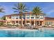 Resort-style pool with expansive clubhouse and palm trees at 2713 Roadster Ln, Kissimmee, FL 34746