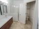 Bright bathroom with double vanity, shower, and toilet at 304 Ferrara Ct, Kissimmee, FL 34758