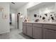 Bathroom boasts double sinks, modern vanity, and ample storage at 362 Alexzander Way, Winter Haven, FL 33881