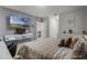 Modern bedroom with large TV, built-in desk, and comfortable bedding at 362 Alexzander Way, Winter Haven, FL 33881