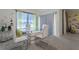 Dining room with a glass-top table and white chairs at 362 Alexzander Way, Winter Haven, FL 33881