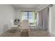 Dining room with glass-top table and white chairs at 362 Alexzander Way, Winter Haven, FL 33881