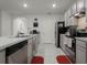 Well-equipped kitchen with stainless steel appliances and ample counter space at 362 Alexzander Way, Winter Haven, FL 33881