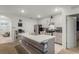 Modern kitchen with gray cabinets, stainless steel appliances, and an island at 362 Alexzander Way, Winter Haven, FL 33881