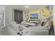 Living room with sectional sofa and geometric wall art at 362 Alexzander Way, Winter Haven, FL 33881