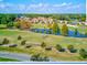 Aerial view of community with golf course and pond at 3984 Atrium Dr # 4, Orlando, FL 32822