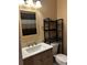 Bright bathroom featuring a vanity and large mirror at 3984 Atrium Dr # 4, Orlando, FL 32822