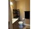 Updated bathroom with a modern vanity, and a convenient shelving unit for extra storage at 3984 Atrium Dr # 4, Orlando, FL 32822