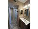 Bathroom featuring a modern vanity, tile flooring, and unique shelves for storage at 3984 Atrium Dr # 4, Orlando, FL 32822