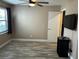 Bedroom with wood-look floors, window, and ceiling fan at 3984 Atrium Dr # 4, Orlando, FL 32822