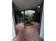 Brick courtyard with tropical plants and a central planter at 3984 Atrium Dr # 4, Orlando, FL 32822