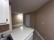 View from kitchen into living area, showcasing a galley style kitchen at 3984 Atrium Dr # 4, Orlando, FL 32822