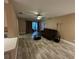 Inviting living room with wood-look floors, a ceiling fan, and comfortable seating for relaxing and entertaining at 3984 Atrium Dr # 4, Orlando, FL 32822