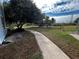 Curved walkway winds through landscaped grounds at 3984 Atrium Dr # 4, Orlando, FL 32822