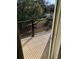 Private balcony overlooking a backyard with trees at 4372 Paradise Cove Ct, Kissimmee, FL 34746