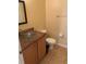 Small bathroom with granite vanity and glass sink at 4372 Paradise Cove Ct, Kissimmee, FL 34746