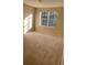 Spacious carpeted bedroom with large window at 4372 Paradise Cove Ct, Kissimmee, FL 34746