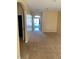 Bright entryway with view to the backyard through the open door at 4372 Paradise Cove Ct, Kissimmee, FL 34746