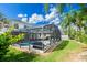 Screened pool and patio area with lush green grass at 438 Birkdale St, Davenport, FL 33897