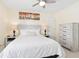 Bedroom with queen bed and dresser at 438 Birkdale St, Davenport, FL 33897