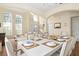 Bright dining room with large table, seating for six, and a view into the living room at 438 Birkdale St, Davenport, FL 33897