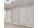 Bedroom with louvered doors and light gray walls at 4505 Haylock Dr, Orlando, FL 32807