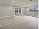 Spacious living area featuring french doors and wood-look floors at 4505 Haylock Dr, Orlando, FL 32807