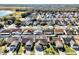 Aerial view of a residential neighborhood with numerous houses and lush green landscaping at 4612 Osceola Point Trl, Kissimmee, FL 34746