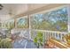 Private balcony with leafy treetop views and outdoor furniture at 651 Celebration Ave # 651, Celebration, FL 34747