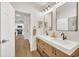 Modern bathroom with double vanity, quartz countertop, and walk-in shower at 651 Celebration Ave # 651, Celebration, FL 34747