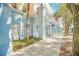 Light blue building exterior with sidewalk, landscaping, and a business sign at 651 Celebration Ave # 651, Celebration, FL 34747