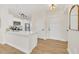 Kitchen with white cabinets and marble countertops is visible from the entryway at 651 Celebration Ave # 651, Celebration, FL 34747